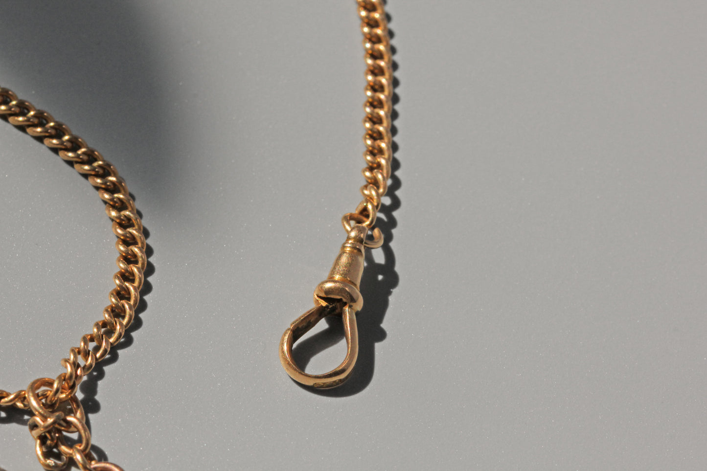 Antique curb link albert chain, in 18 carat gold