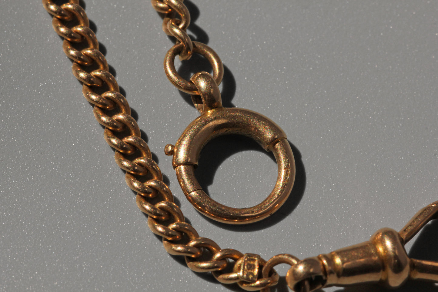 Antique curb link albert chain, in 18 carat gold