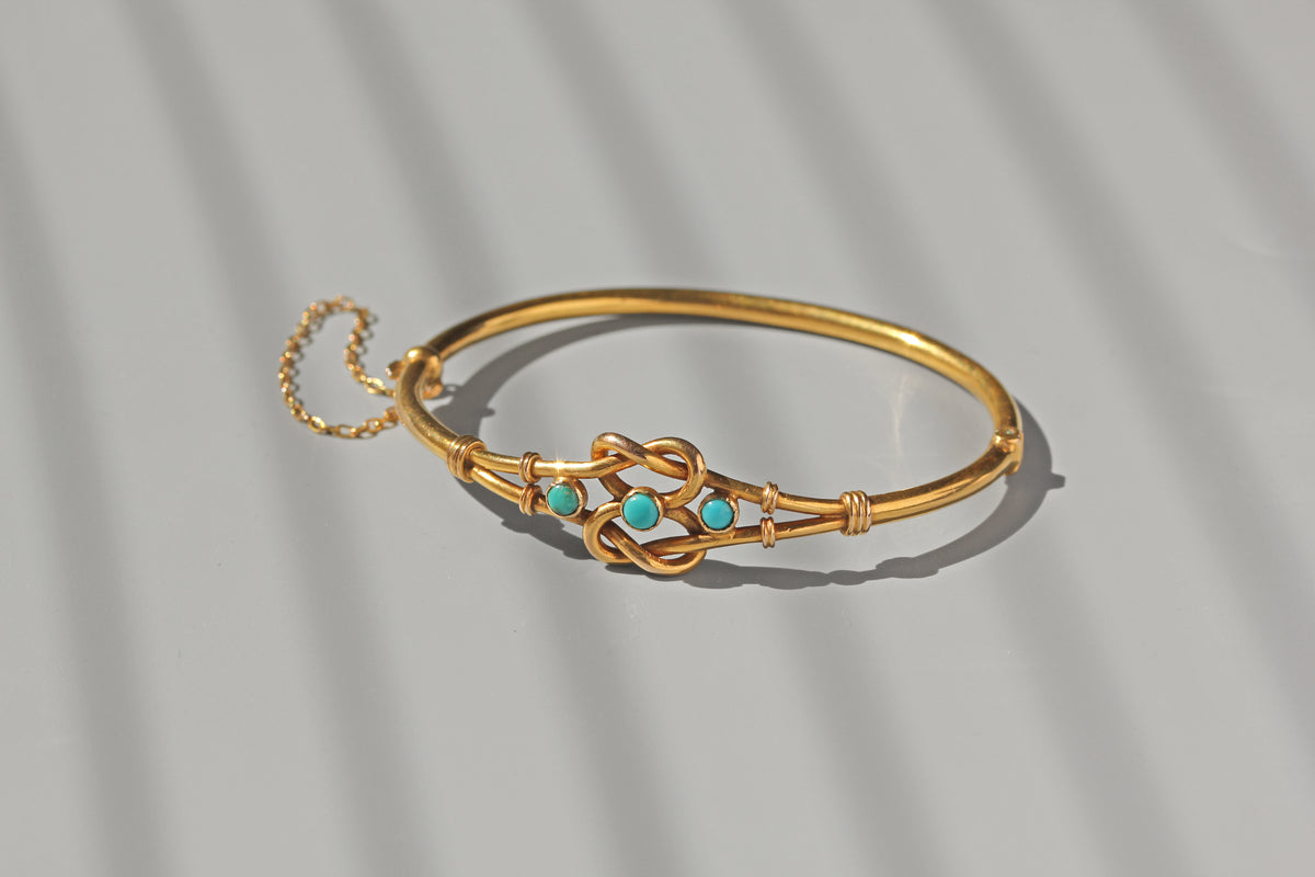 Antique turquoise lovers knot bangle in 18 carat gold
