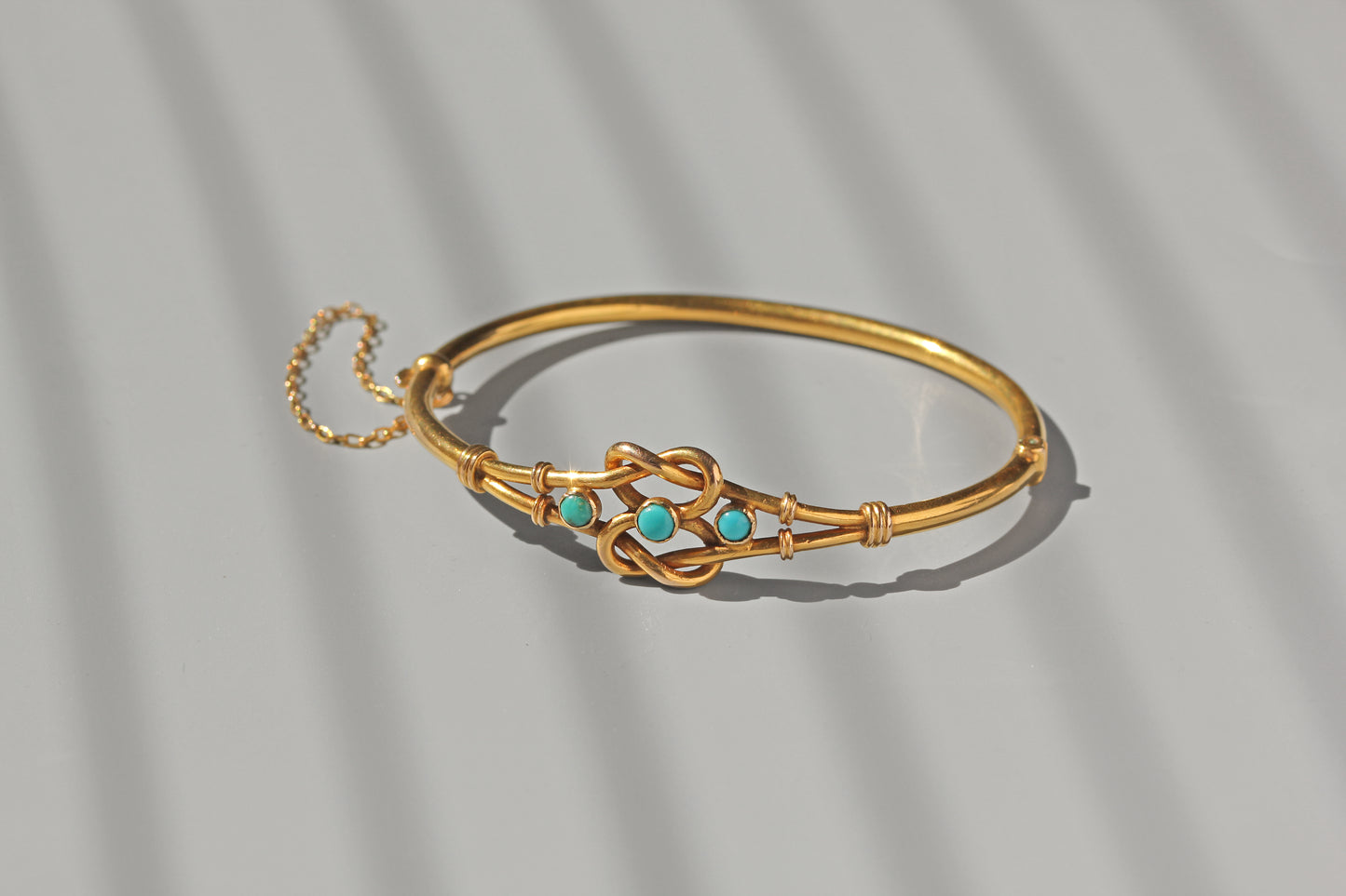 Antique turquoise lovers knot bangle in 18 carat gold
