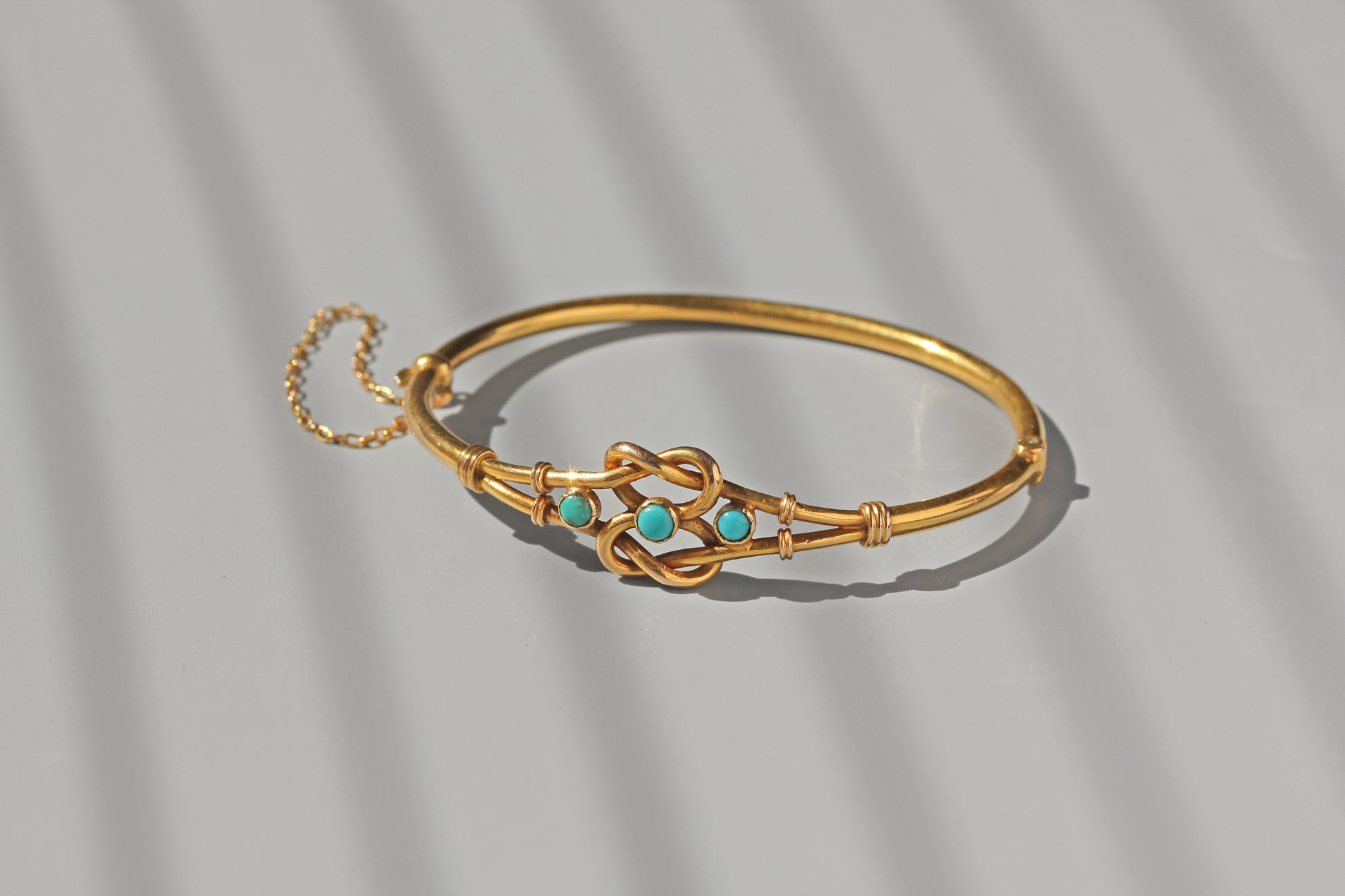 Antique turquoise lovers knot bangle in 18 carat gold

