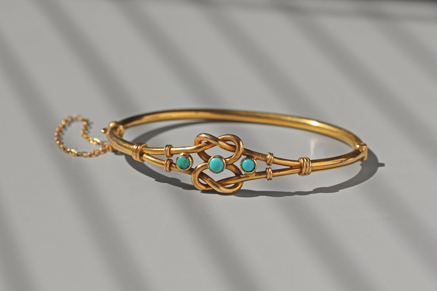 Antique turquoise and gold bangle with safety chain

