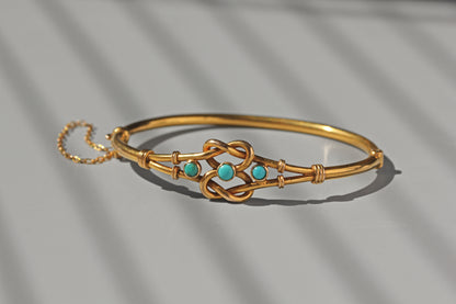 Antique turquoise and gold bangle with safety chain
