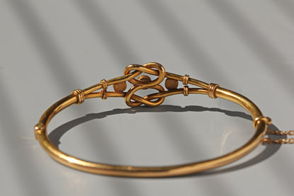 Antique turquoise lovers knot bangle, in 18 carat gold