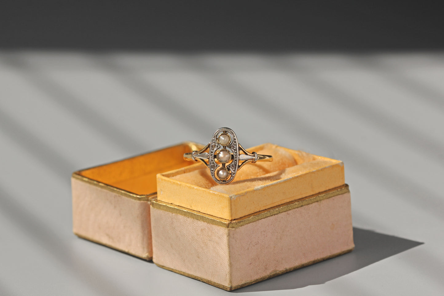 Antique gold diamond and pearl ring elongated setting