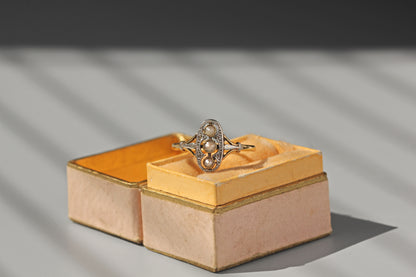 Antique gold diamond and pearl ring elongated setting