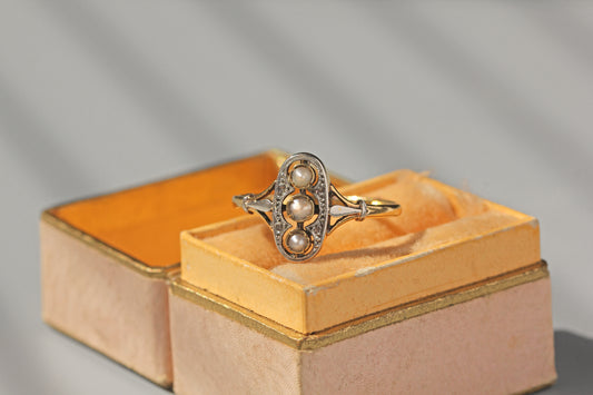 Antique Edwardian diamond and pearl navette ring in 9 carat gold
