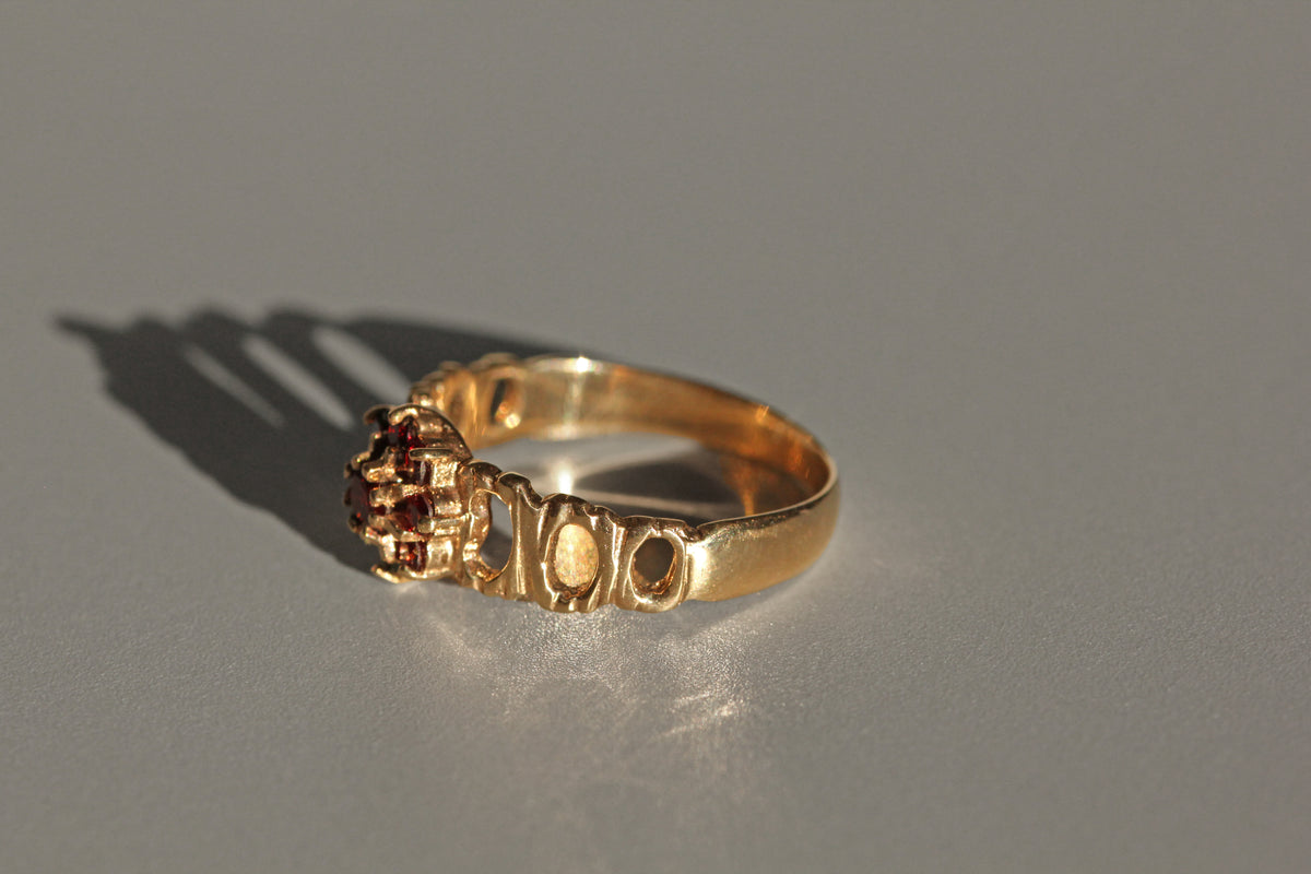 Vintage garnet flower cluster ring in 9 carat gold side profile