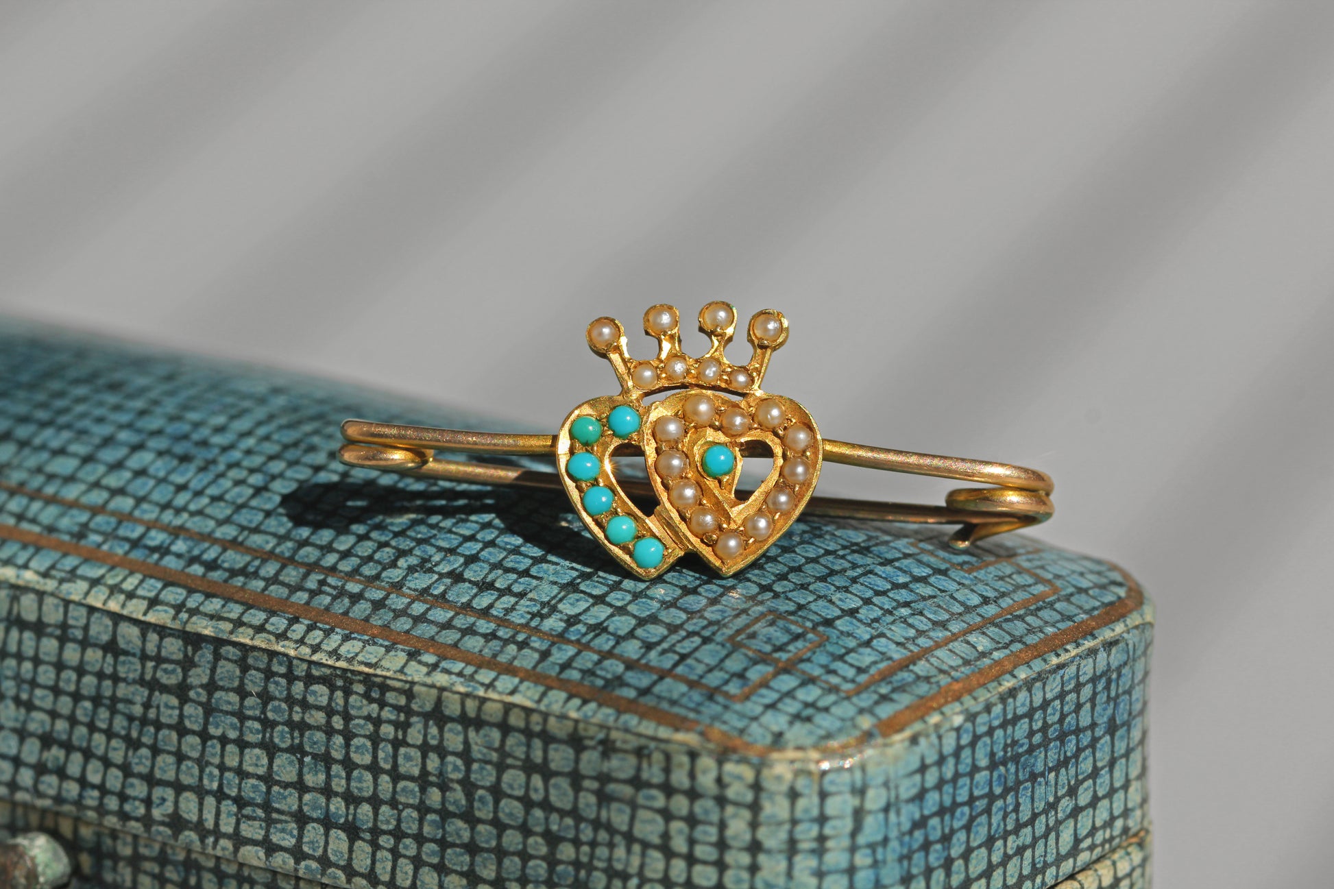 Antique Scottish Luckenbooth style brooch with intertwined hearts and pearl detailing
