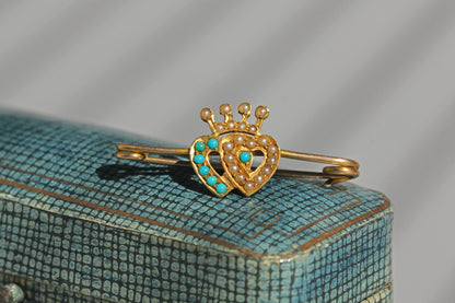 Antique Scottish Luckenbooth style brooch with intertwined hearts and pearl detailing
