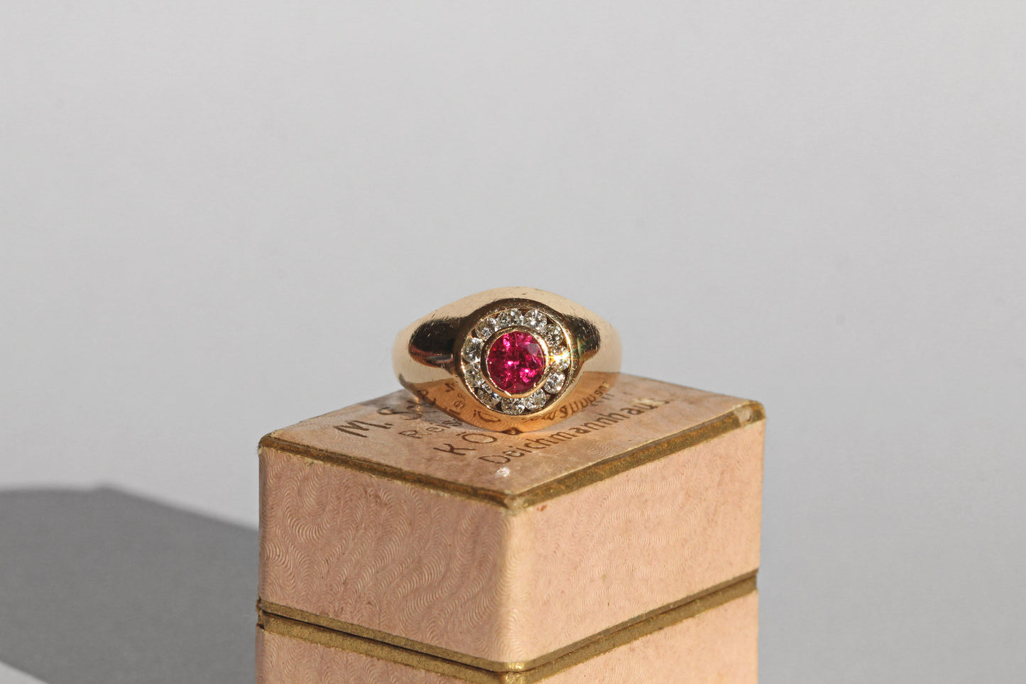 Vintage ruby and diamond bombe ring in 14 carat gold