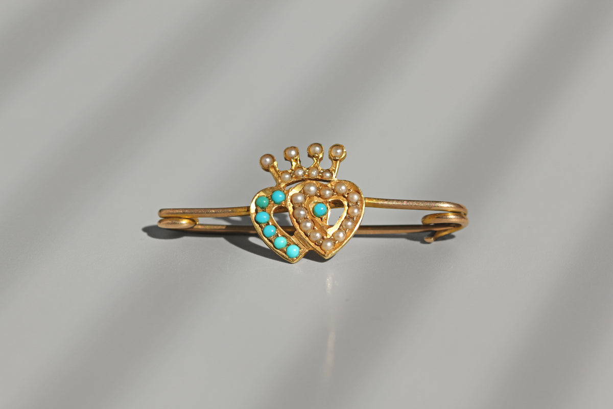 Victorian double heart sweetheart brooch with turquoise and pearl decoration
