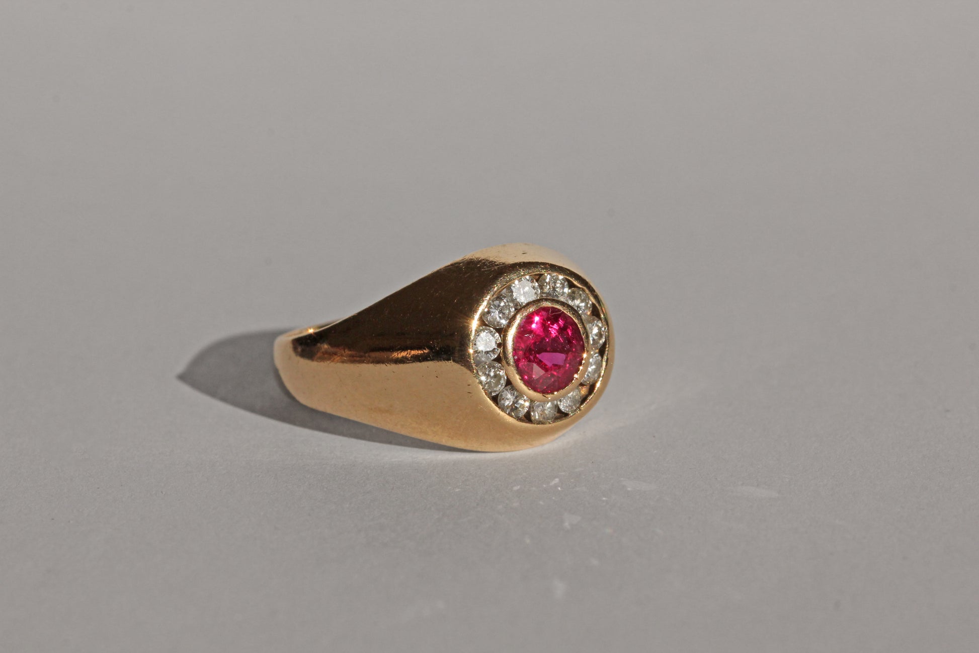 Side view of vintage ruby and diamond signet style ring