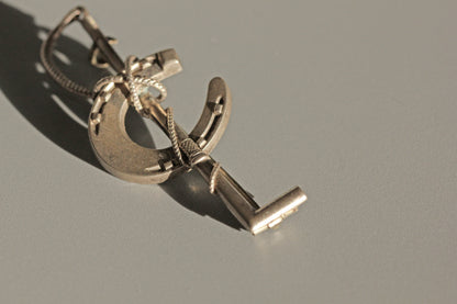 Antique lucky horseshoe riding crop brooch, in sterling silver