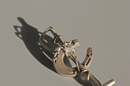 Antique lucky horseshoe riding crop brooch, in sterling silver