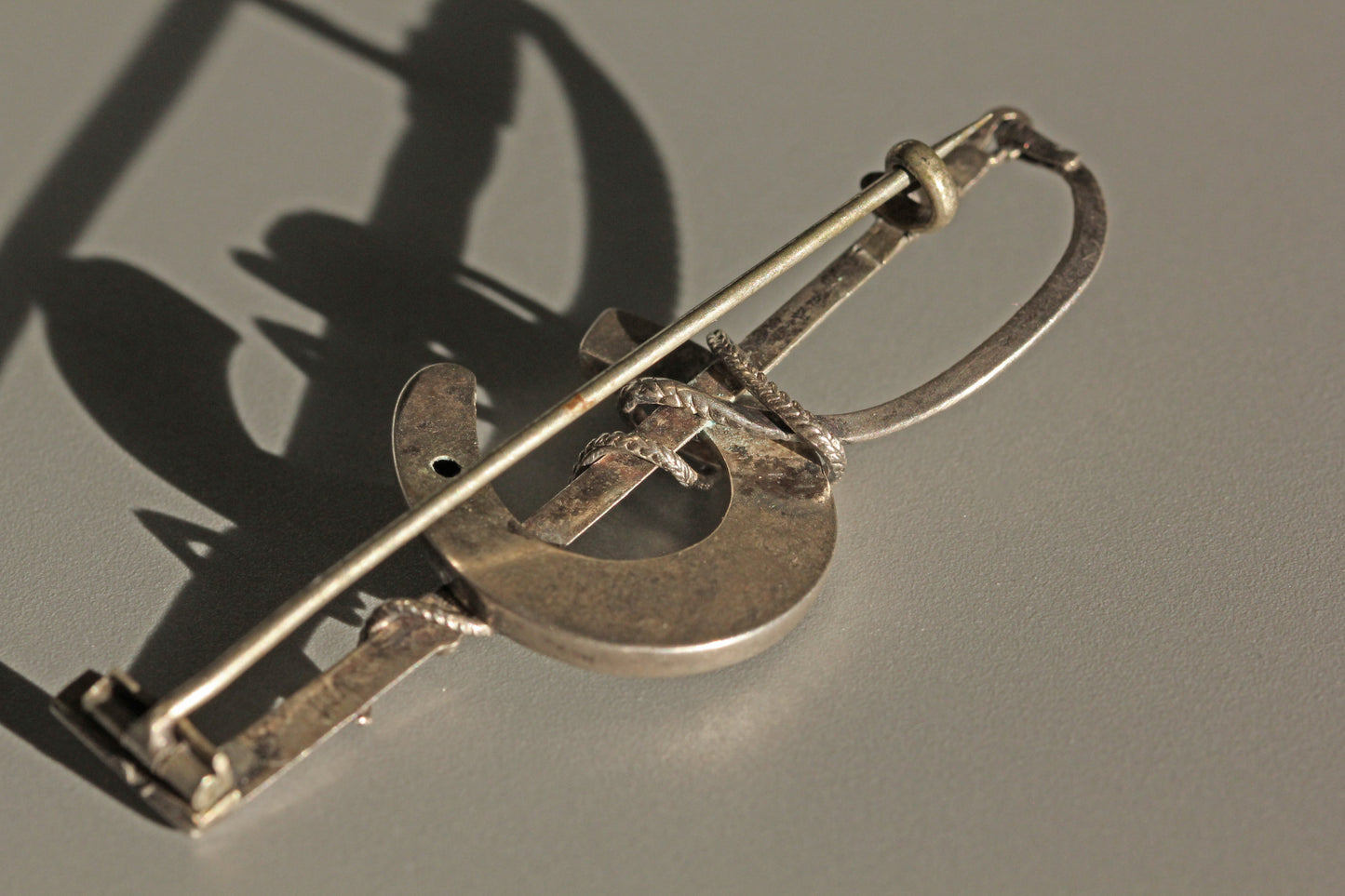 Antique lucky horseshoe riding crop brooch, in sterling silver