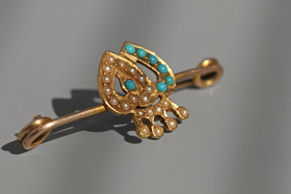 Victorian turquoise cabochon and seed pearl brooch with traditional crowned heart design
