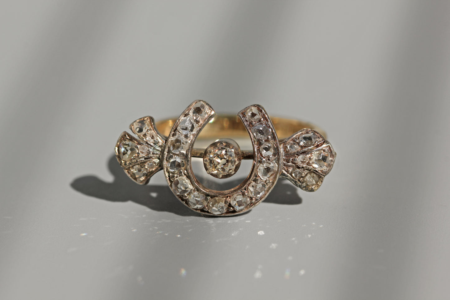 Close up antique rose cut diamond horseshoe ring
