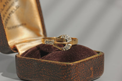 Vintage diamond belt buckle ring in 9 carat gold on ring box
