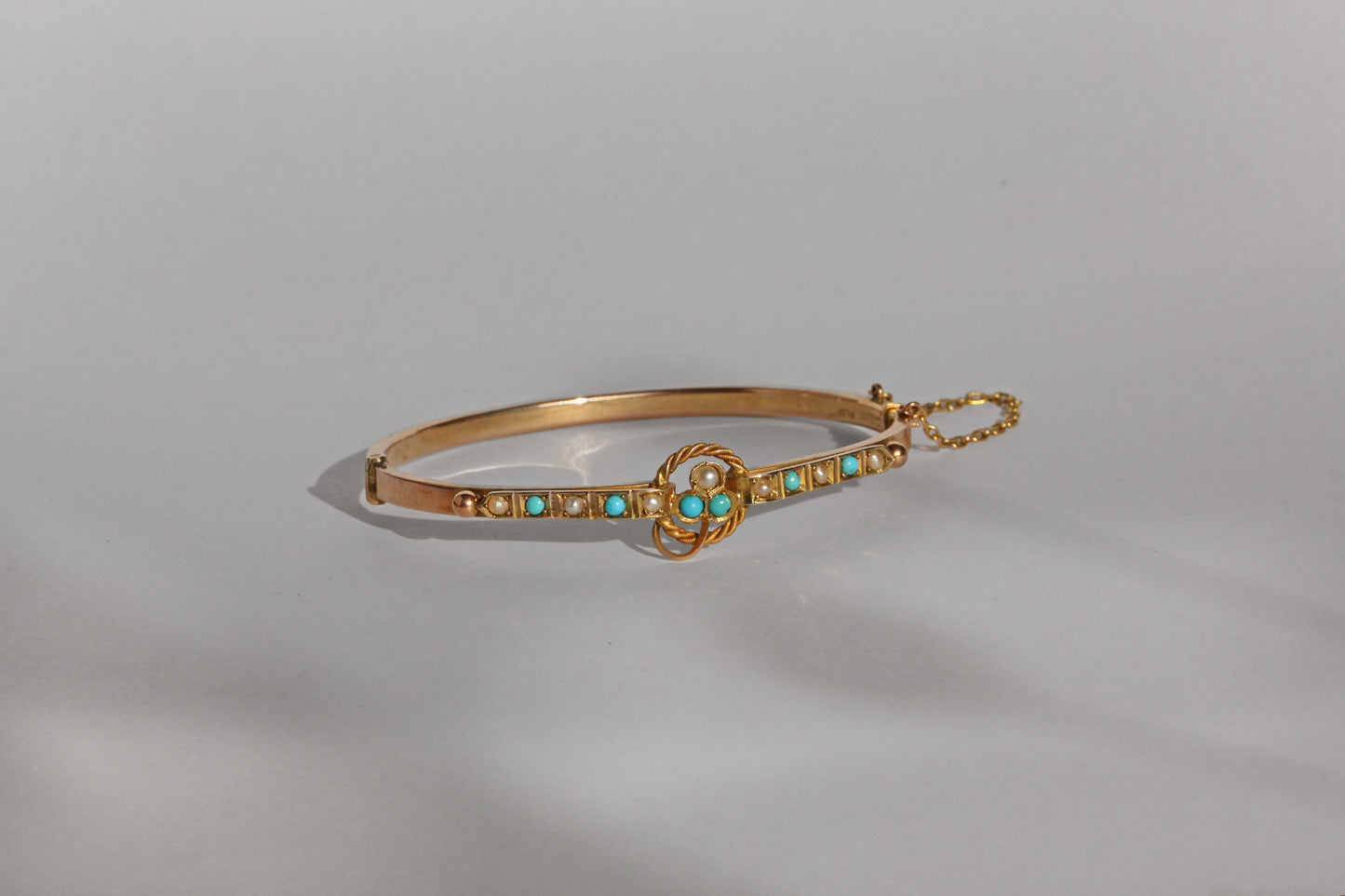 Antique turquoise and pearl ivy or clover bangle, in 9 carat gold