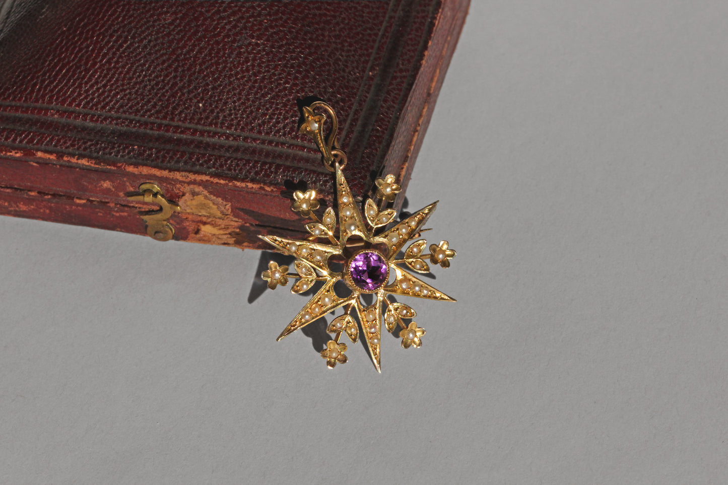 Antique seed pearl star brooch with forget-me-not detailing
