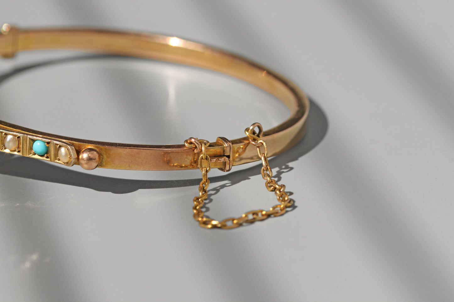 side view of antique gold bangle clasp 
