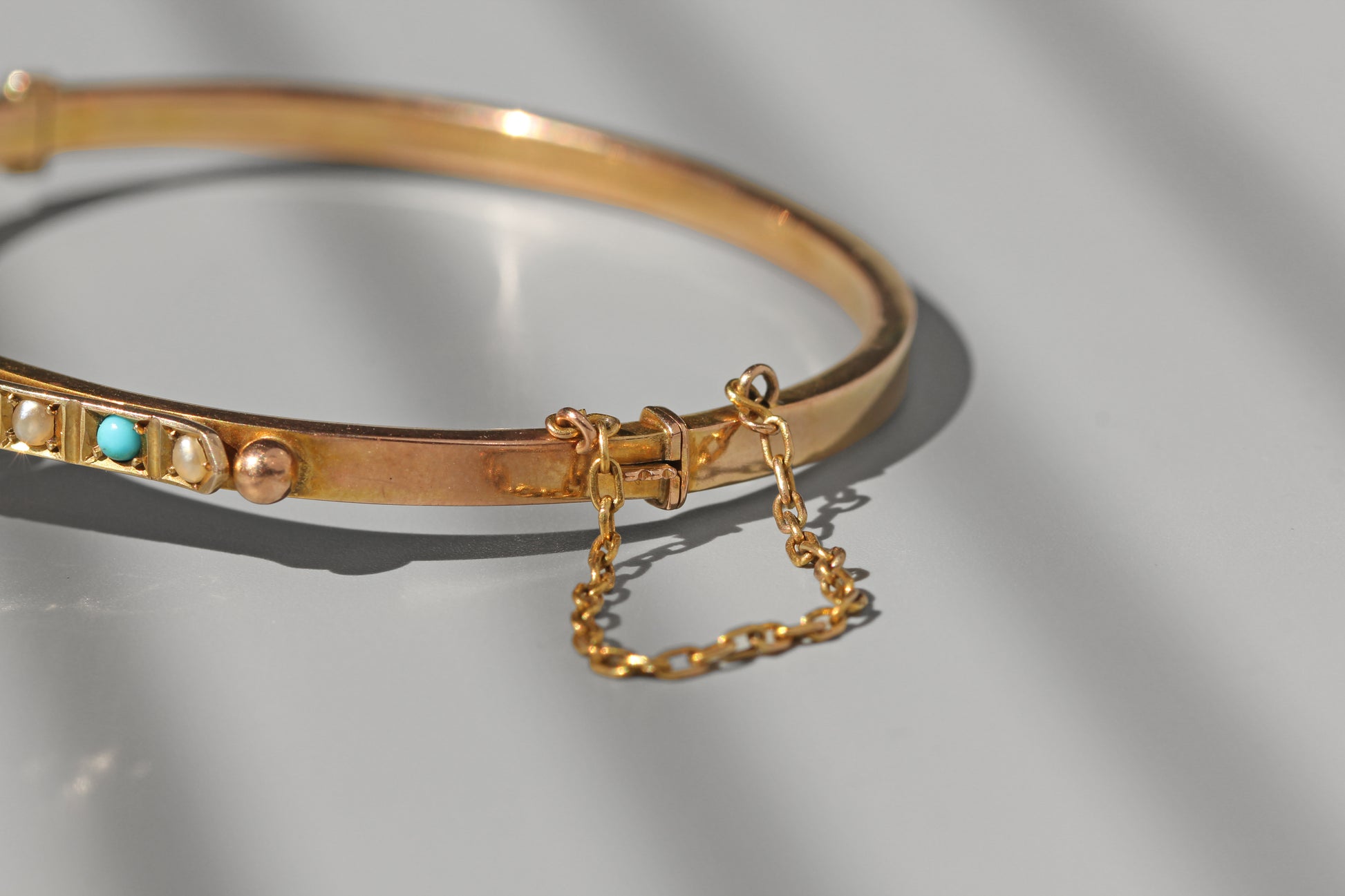 side view of antique gold bangle clasp 
