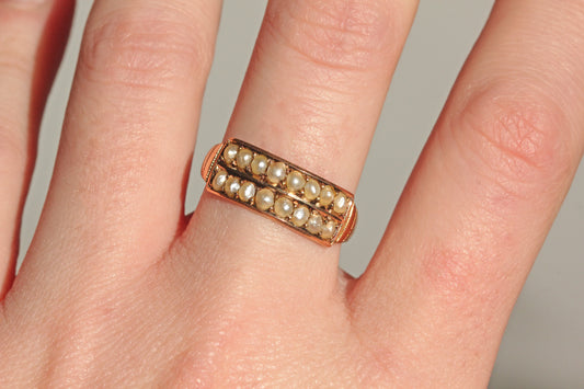 Antique pearl band ring with engraved shoulders detail on finger