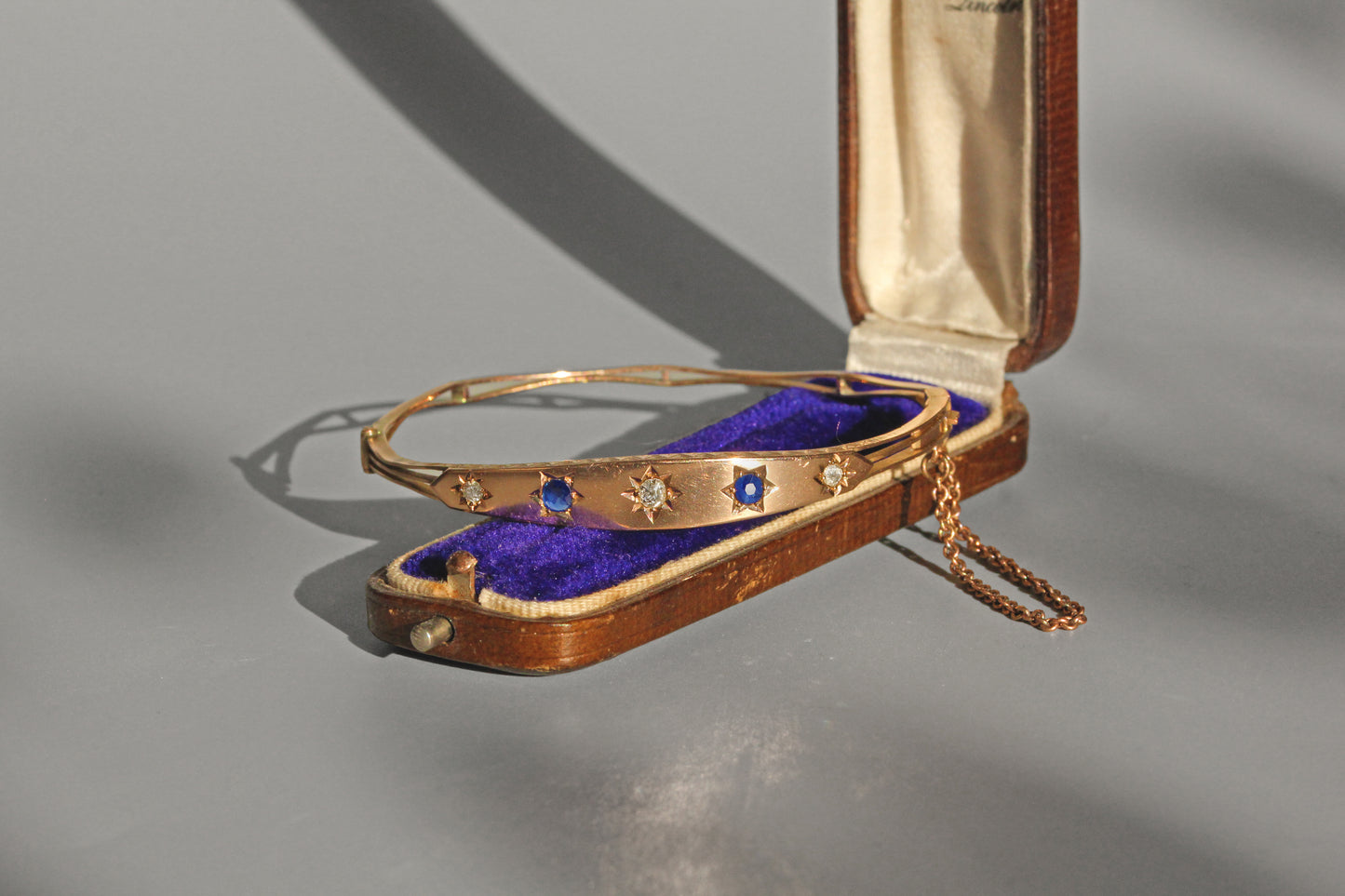 Antique Victorian sapphire and diamond hinged bangle in 9 carat gold