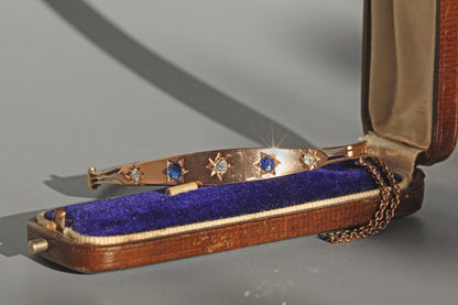 Victorian gold bangle with engraved geometric details
