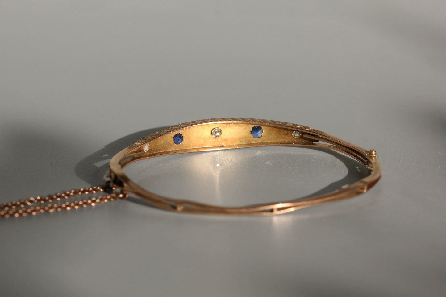 Antique victorian diamond and sapphire bangle, in 9 carat gold