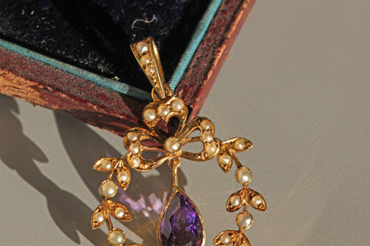 Antique amethyst pendant with openwork garland design
