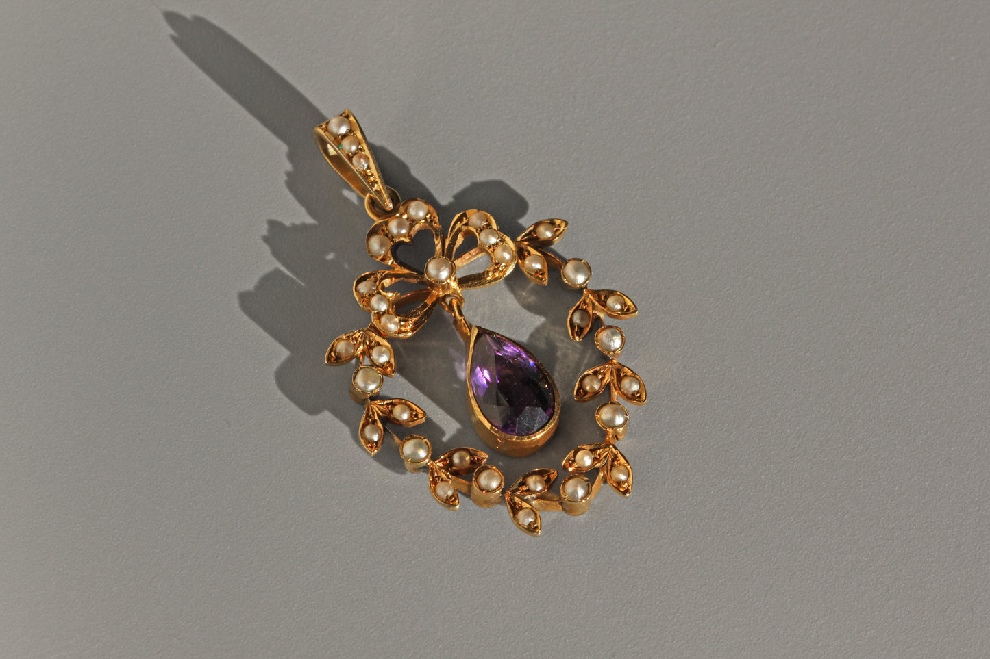 Side view of Victorian amethyst and pearl pendant
