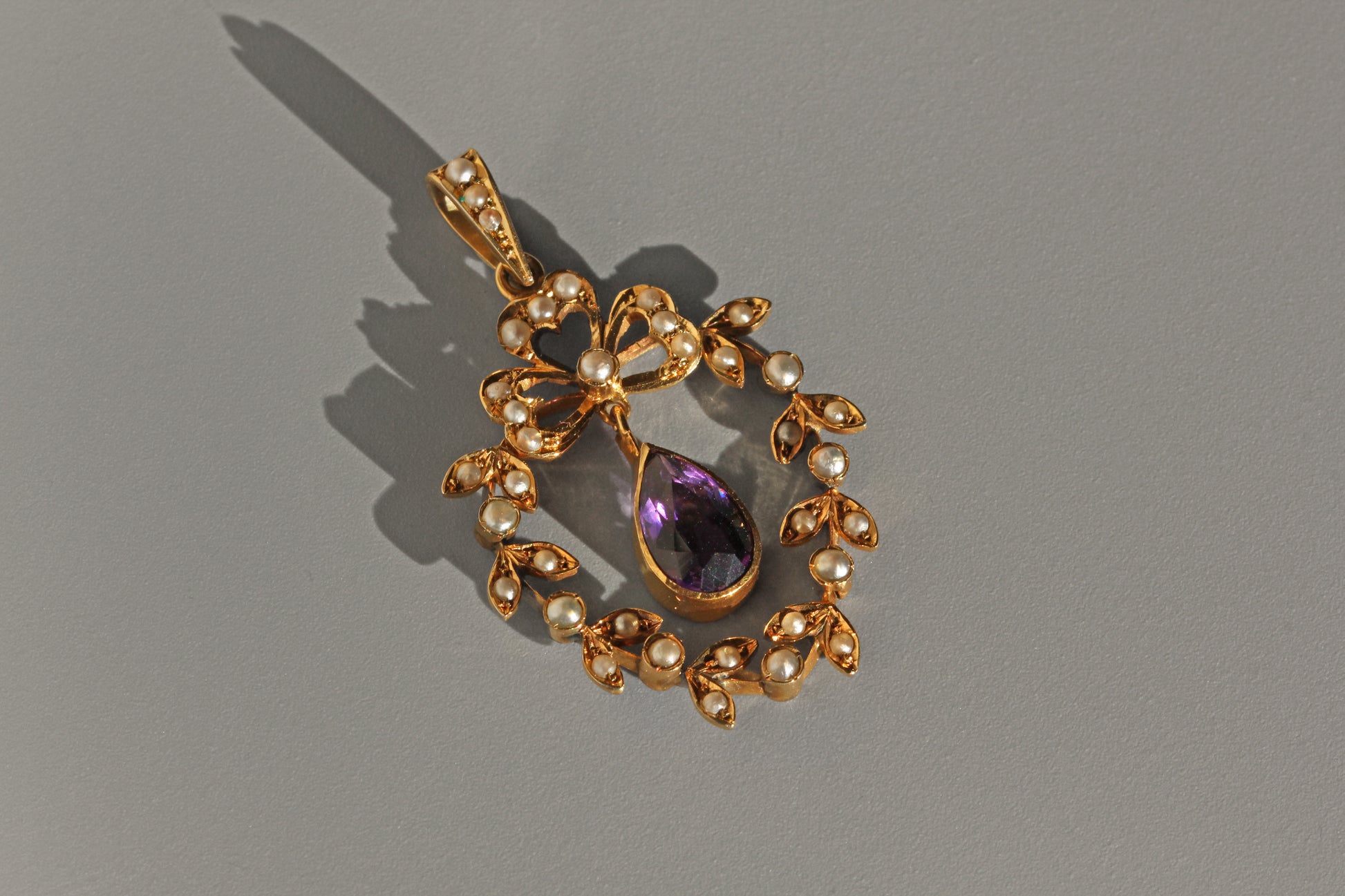 Side view of Victorian amethyst and pearl pendant
