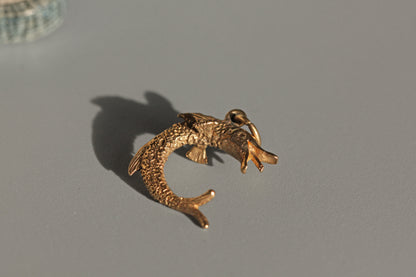 Detailed vintage fish charm with open mouth and fin detail