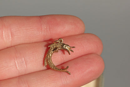 Vintage gold pike fish charm in 9 carat gold on hand