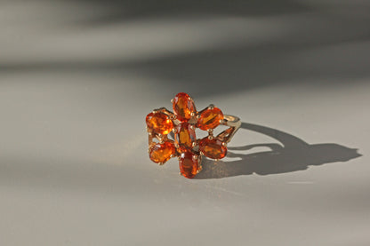 Vintage orange topaz flower cluster ring, in 9 carat gold