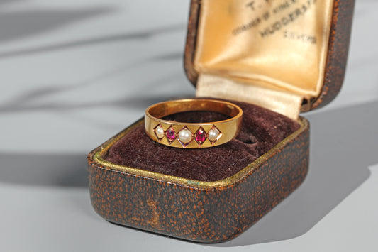 Antique ruby and pearl band ring in 18 carat gold on antique ring box
