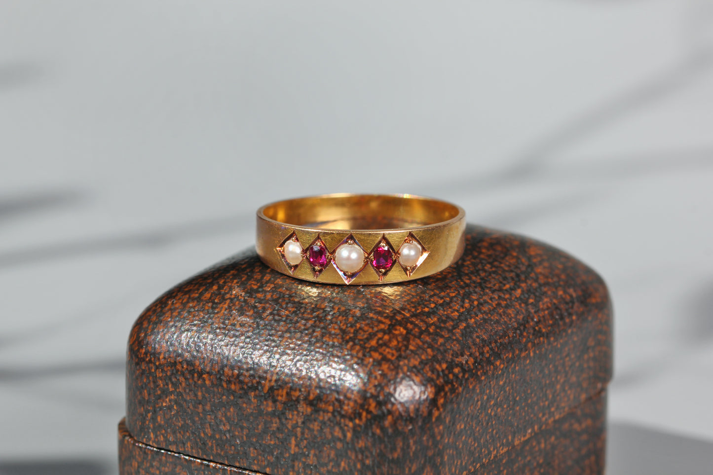 Victorian ruby and pearl five stone band ring
