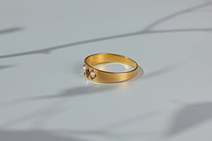Close up antique ruby and pearl band ring
