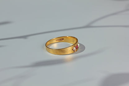 Antique ruby and pearl band ring, in 18 carat gold