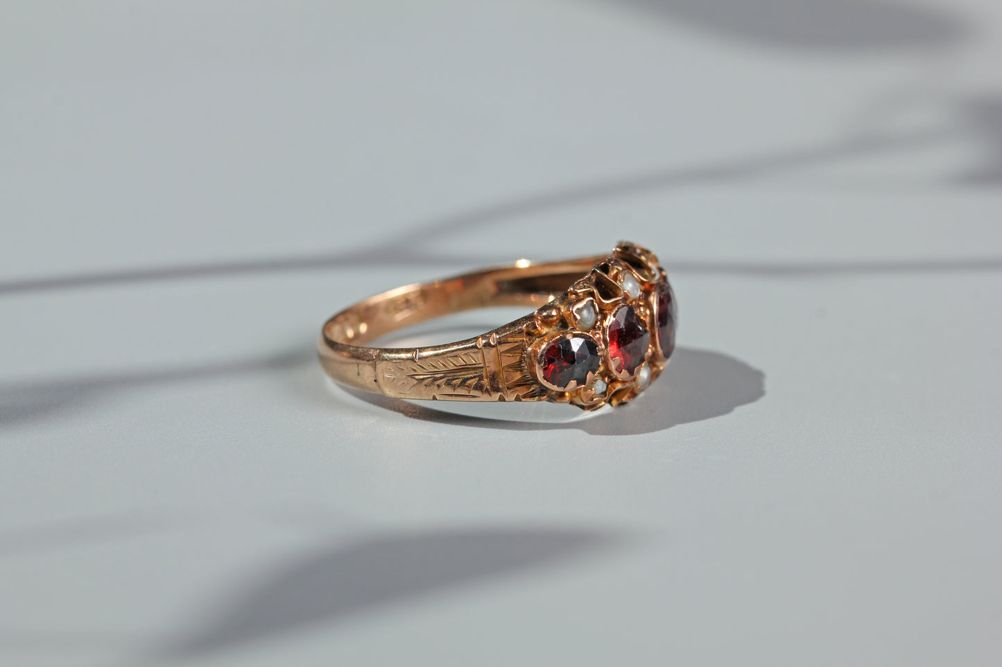 Antique garnet and pearl half hoop ring, in 9 carat gold