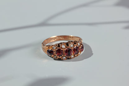 Antique garnet and pearl half hoop ring, in 9 carat gold