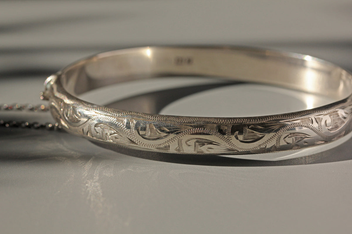Vintage etched cuff bangle bracelet in sterling silver close up of intricate design
