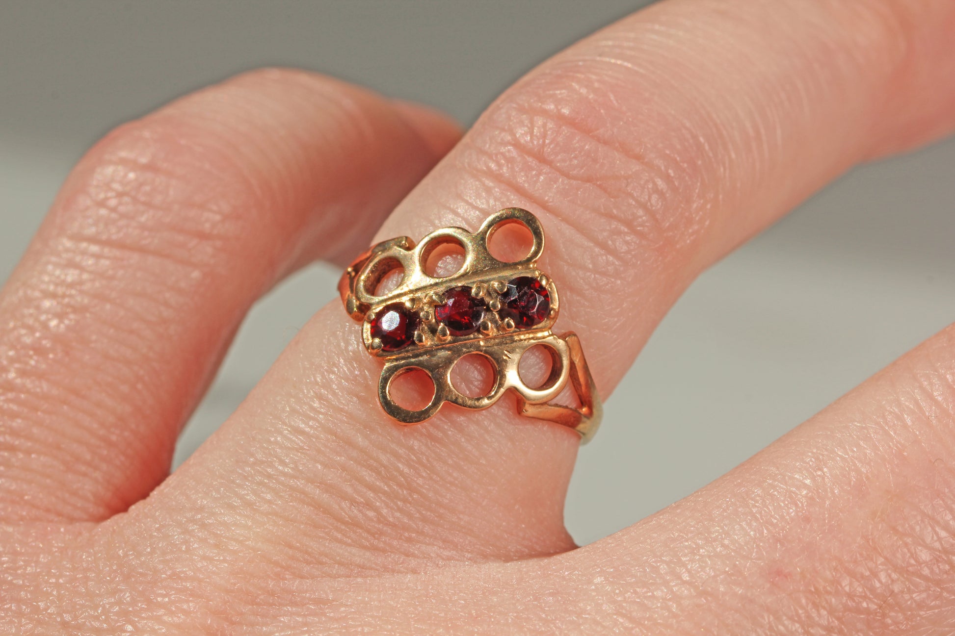 Vintage unique garnet trilogy ring on finger