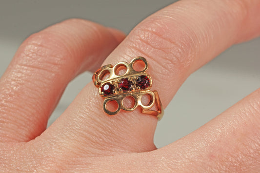 Vintage unique garnet trilogy ring on finger