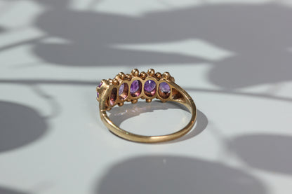 Vintage amethyst five stone ring, in 9 carat gold