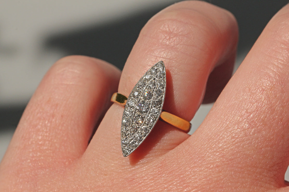 Antique Victorian old cut diamond navette ring in 18ct gold on finger