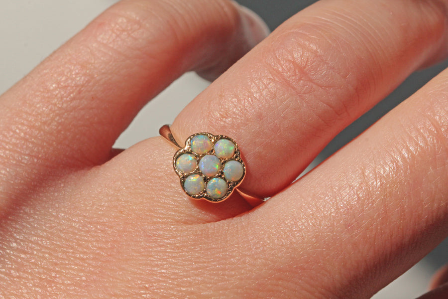 Vintage opal flower cluster ring in 9ct gold on finger