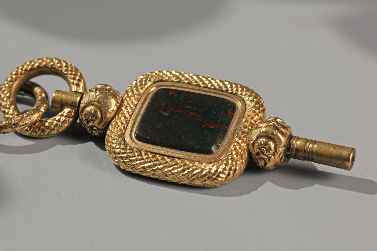 Antique bloodstone watch key with split ring, in 9 carat gold